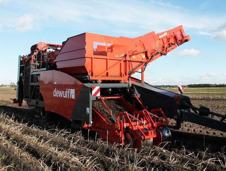Potato harvester in field